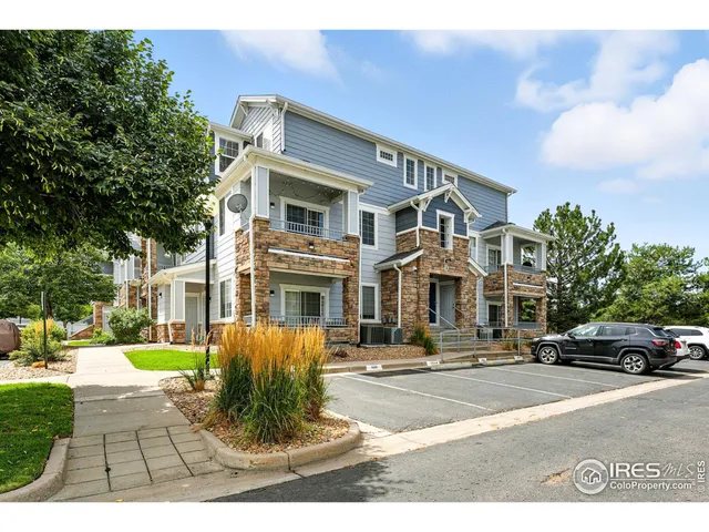 a front view of a building with garden