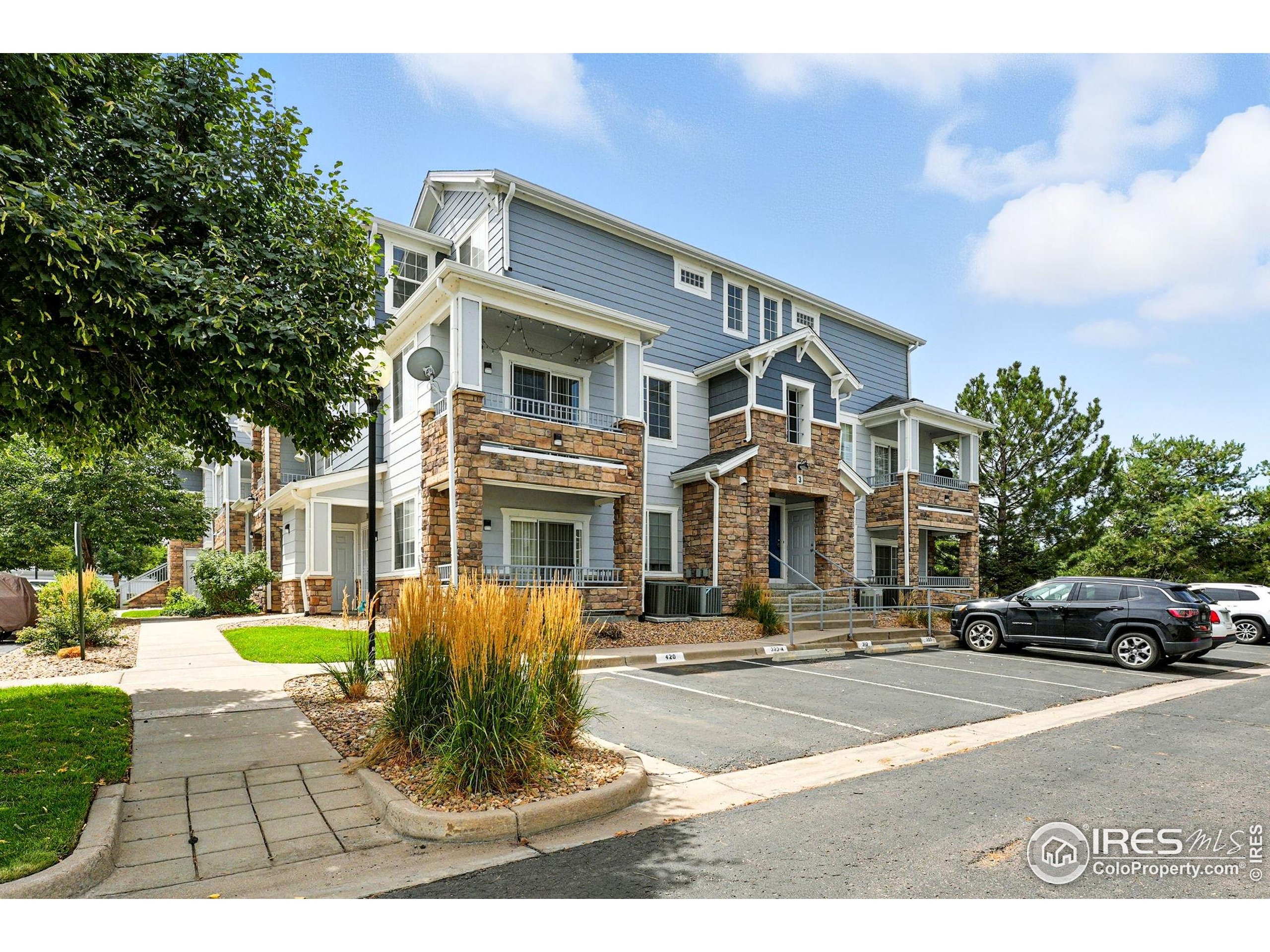 a front view of a building with garden