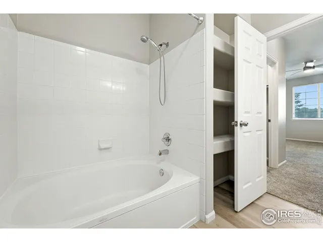 a bathroom with a bathtub and a shower