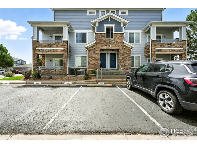 a front view of a house with parking space
