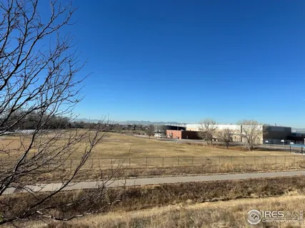 a view of an empty room with a fireplace
