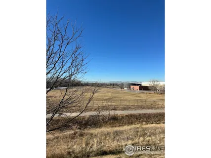a bathroom with a granite countertop toilet a sink and a mirror