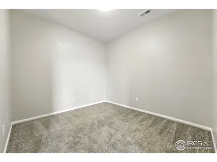 a view of a street with cars in front of it