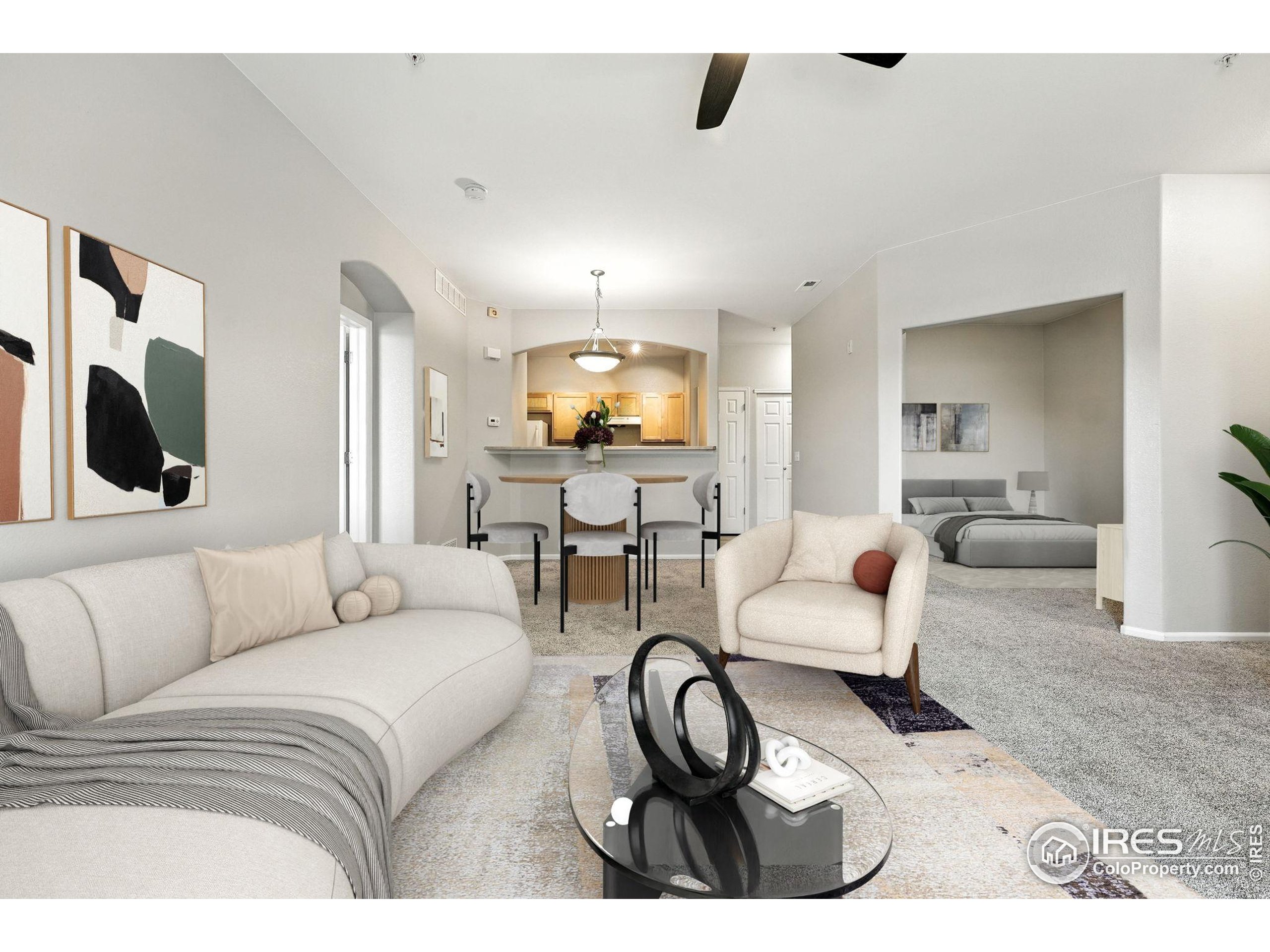 5255 Memphis Street, Unit 312 Denver, CO 80239 - Photo 6 of 44 a living room with furniture and a flat screen tv