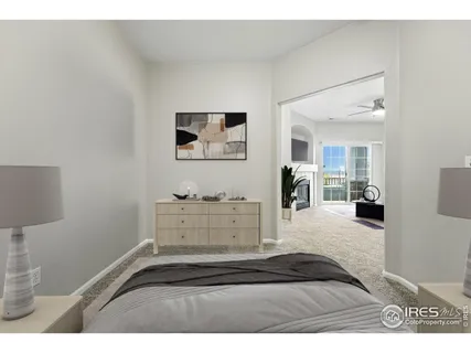 a bedroom with a bed and a desk