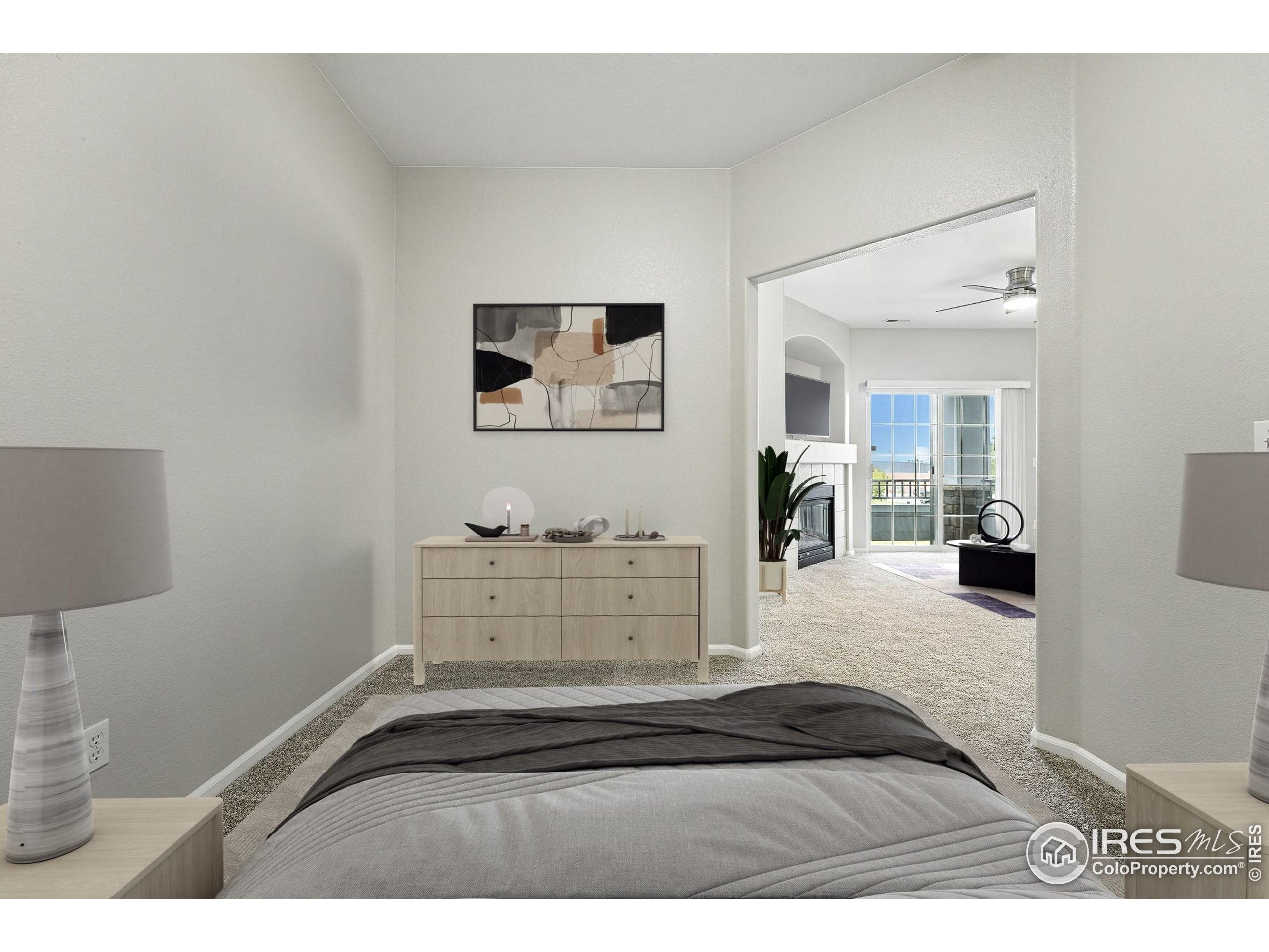 5255 Memphis Street, Unit 312 Denver, CO 80239 - Photo 7 of 44 a bedroom with a bed and a desk