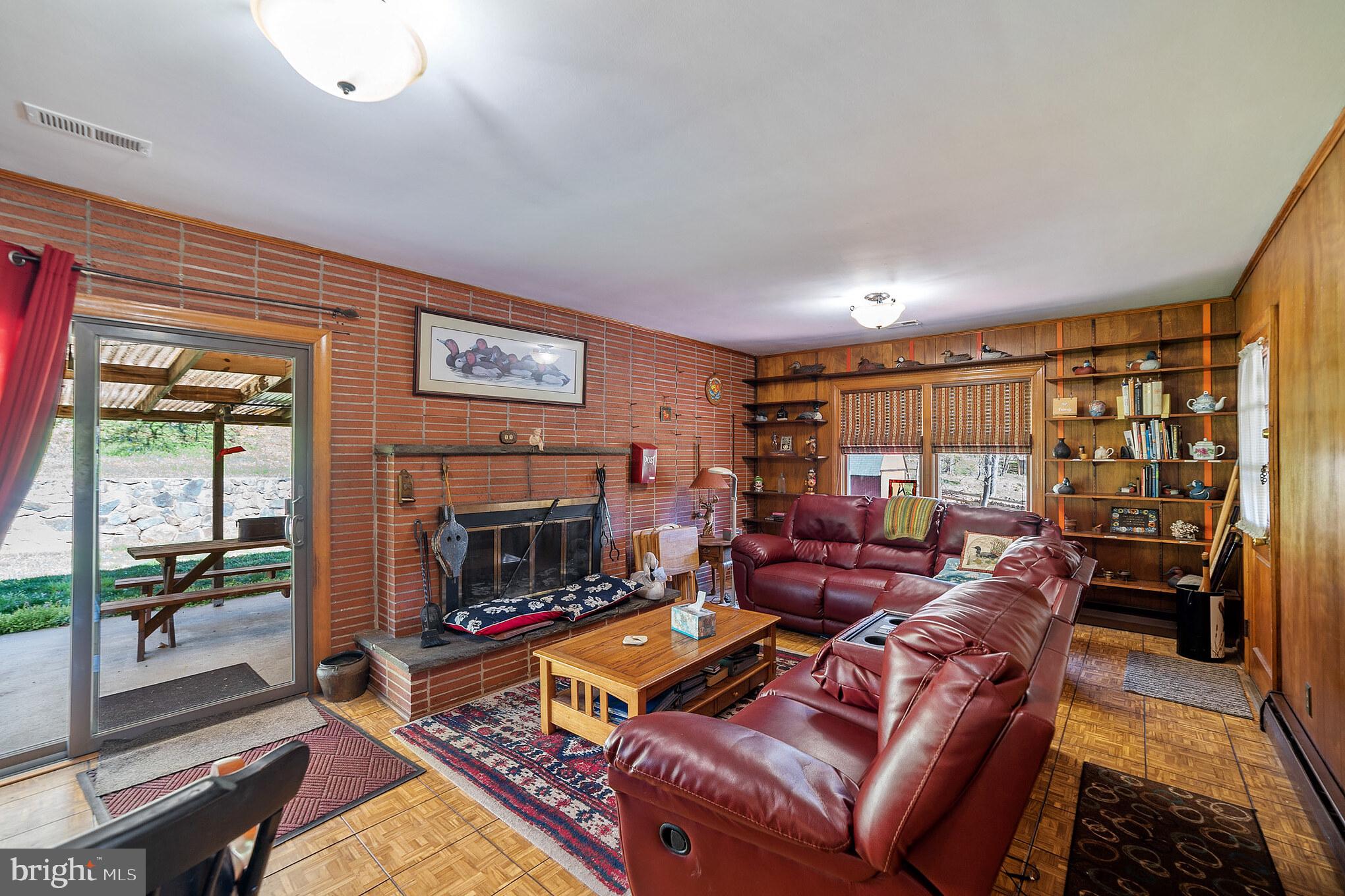 108 Hillside Road Baltimore, MD 21228 - Photo 10 of 36 1st floor family room with woodburning fireplace