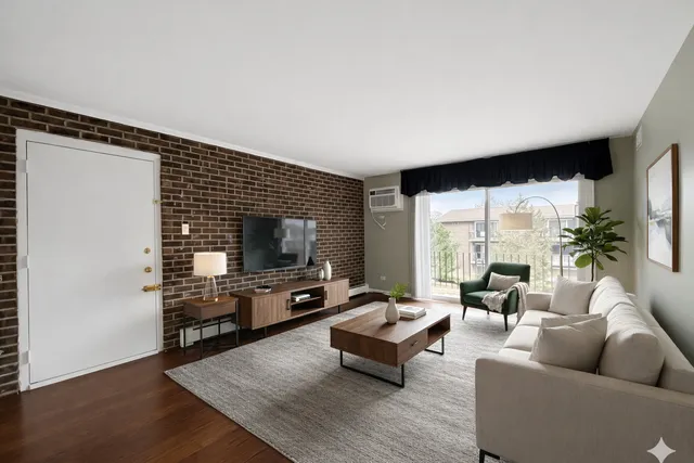 a living room with furniture flat screen tv and a large window