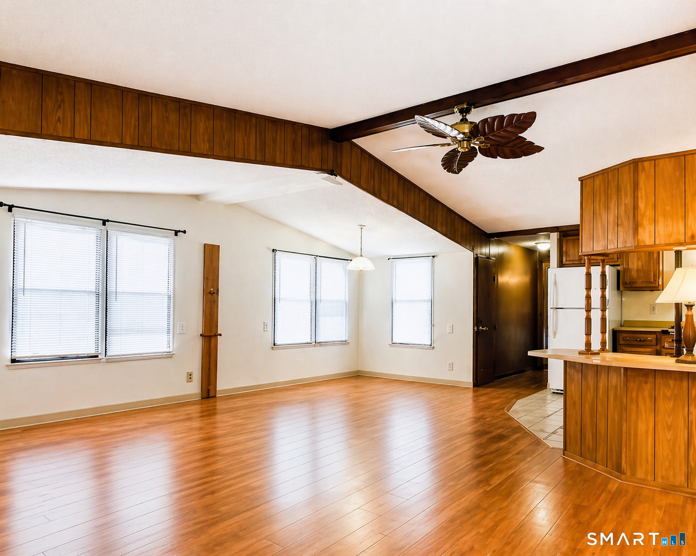 325 Kelly Road Vernon, CT 06066 - Photo 2 of 5 a view of an empty room with wooden floor and a window