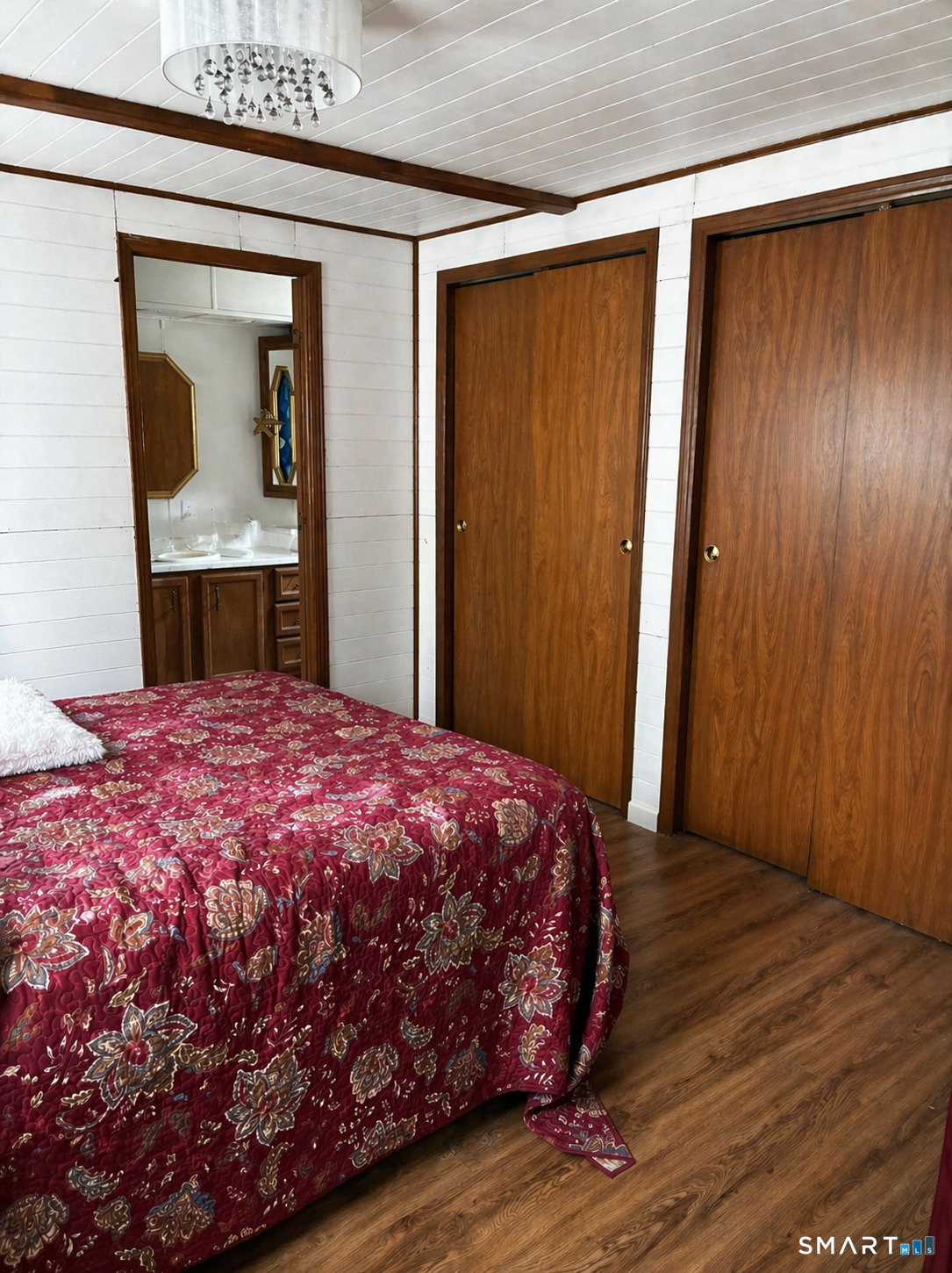 325 Kelly Road Vernon, CT 06066 - Photo 3 of 5 a bedroom with a bed and a mirror