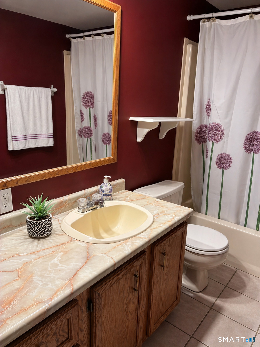 325 Kelly Road Vernon, CT 06066 - Photo 4 of 5 a bathroom with a granite countertop sink and a mirror