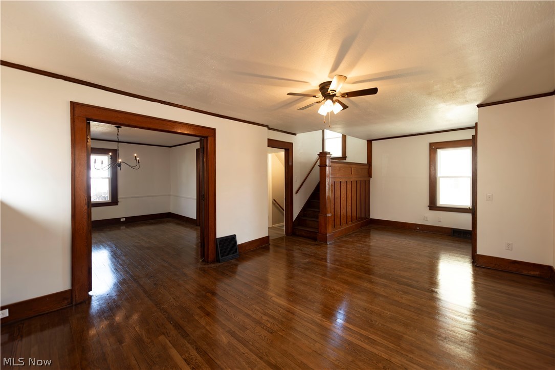 1022 North Howard Street Akron, OH 44310 - Photo 4 of 38 Third shot of living room showing beautiful woodwork on stairway and French doorway leading to dining room.