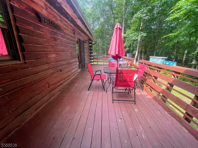 101 Flatbrook Road Branchville, NJ 07827 - Photo 13 of 28 a view of a deck with a table and chairs a barbeque with wooden floor and fence