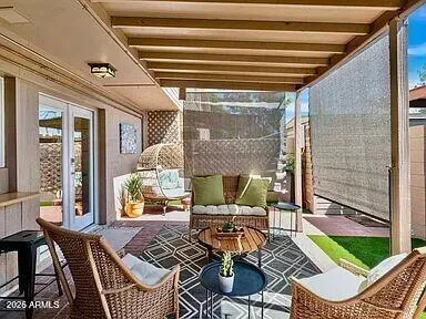 a outdoor living space with patio furniture and a potted plant