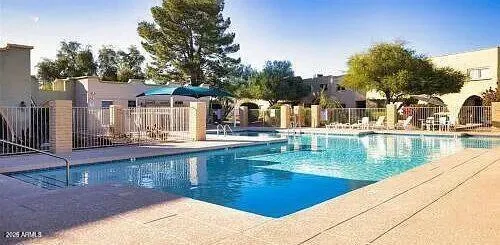 a view of a swimming pool with a patio
