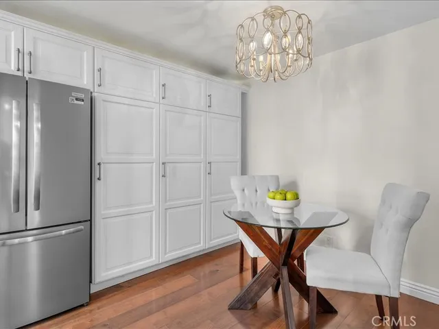 a view of a dining room with furniture and chandelier