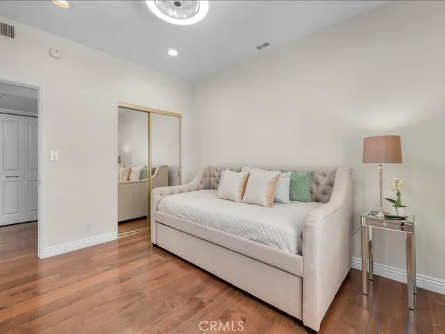 a large white bed in a white room