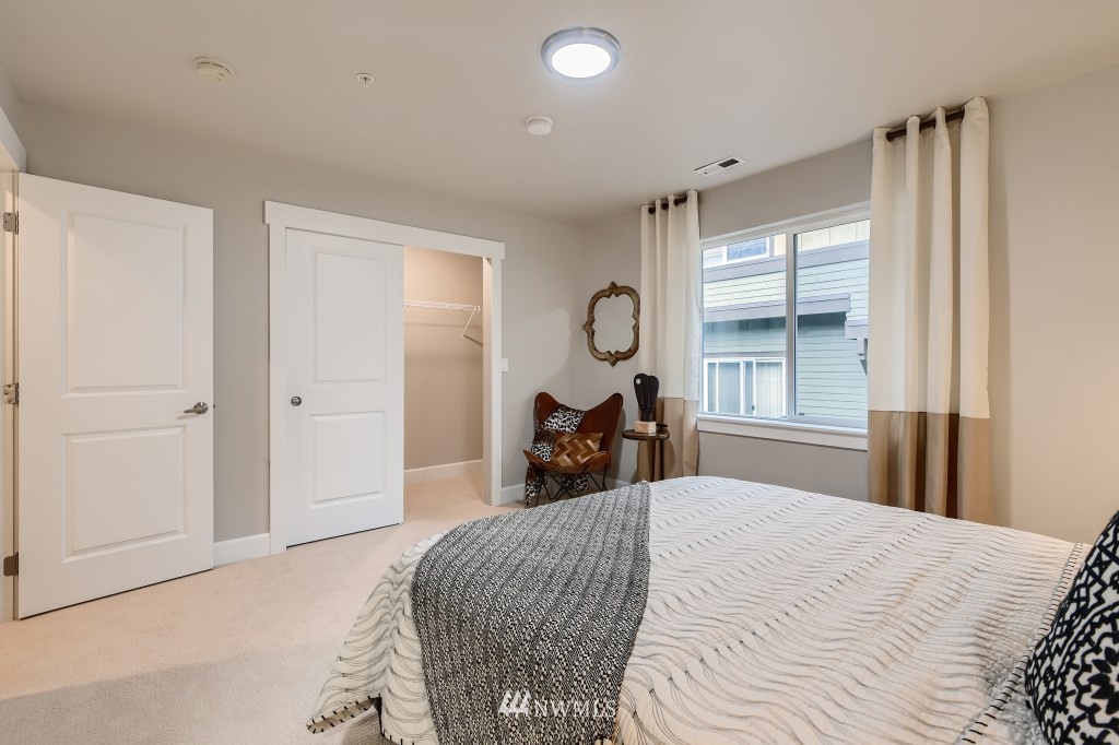 2115 201st Place Southeast, Unit B5 Bothell, WA 98012 - Photo 24 of 28 a bedroom with a bed and window
