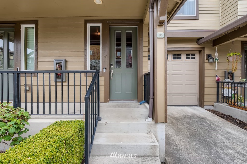 2115 201st Place Southeast, Unit B5 Bothell, WA 98012 - Photo 3 of 28 a front view of a house with a porch