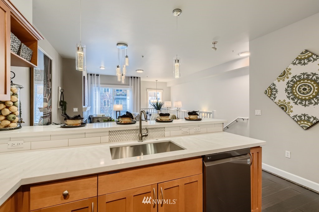 2115 201st Place Southeast, Unit B5 Bothell, WA 98012 - Photo 10 of 28 a view of a kitchen with stainless steel appliances a sink and a counter top space