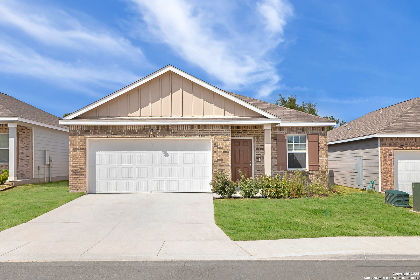 6032 Pearl Meadow Converse, TX 78109 - Photo 1 of 1 a front view of a house with a yard and garage
