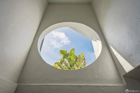 a living room with furniture potted plant and a window