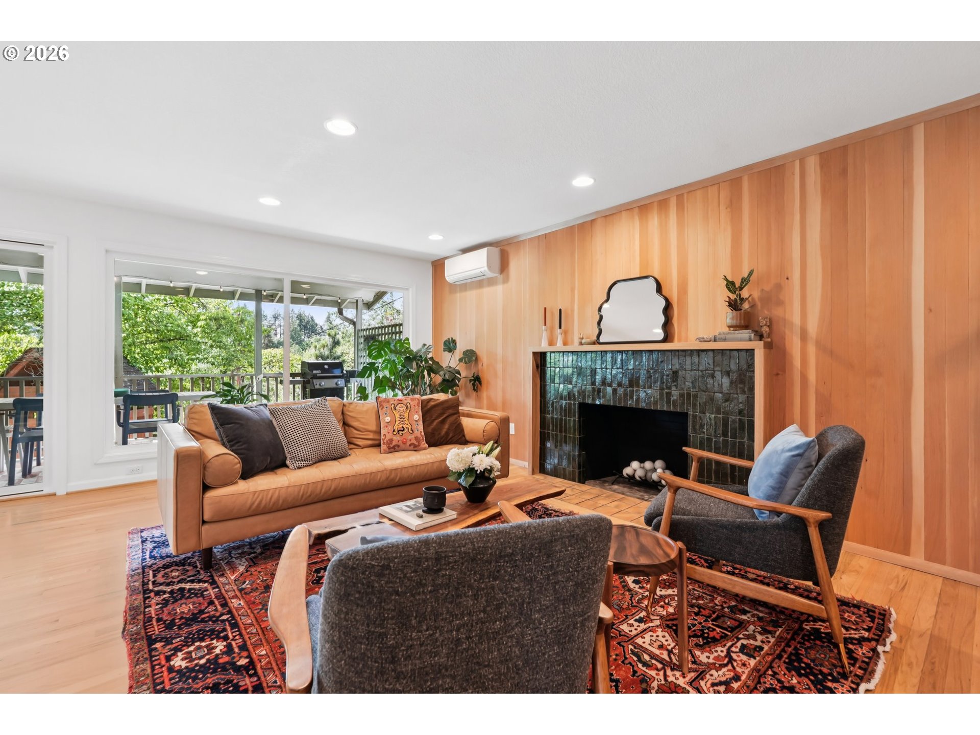 7225 Southwest 13th Avenue Portland, OR 97219 - Photo 7 of 48 a living room with furniture and a fireplace