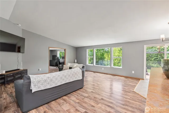 a living room with a couch and a flat screen tv