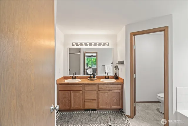 a room with a sink and a mirror