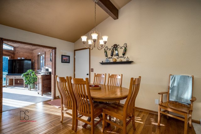 2983 East 1520th Road Ottawa, IL 61350 - Photo 11 of 21 a view of a dining room with furniture and wooden floor