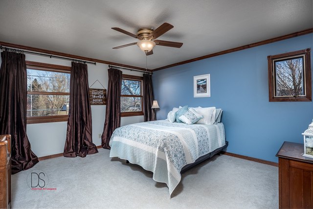2983 East 1520th Road Ottawa, IL 61350 - Photo 14 of 21 a spacious bedroom with a bed and a large window