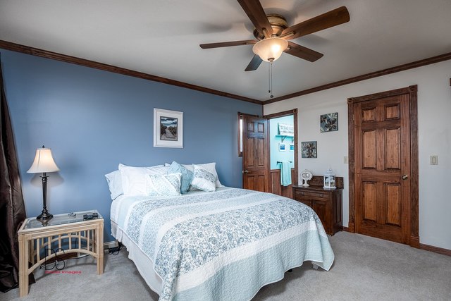 2983 East 1520th Road Ottawa, IL 61350 - Photo 15 of 21 a bedroom with a bed and a lamp on a dresser