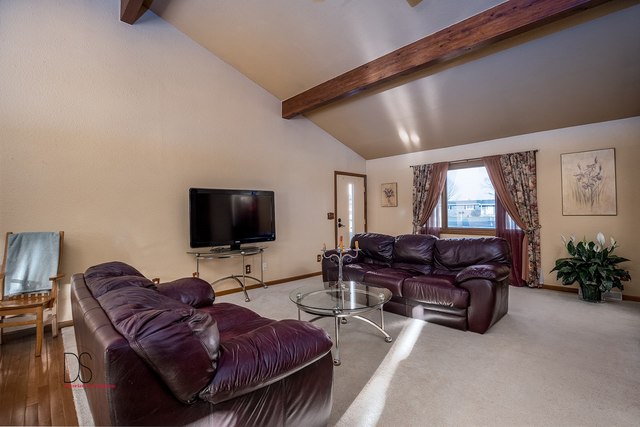 2983 East 1520th Road Ottawa, IL 61350 - Photo 7 of 21 a living room with furniture a flat screen tv and a large window