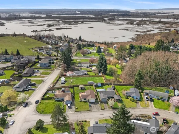 an aerial view of a house with a garden and trees