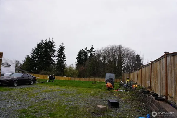 a view of a house with garden space and street view