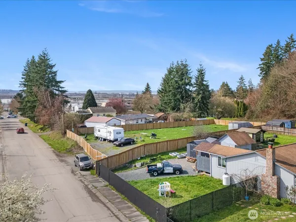 an aerial view of residential houses with outdoor space