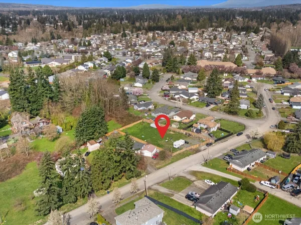 an aerial view of houses with yard