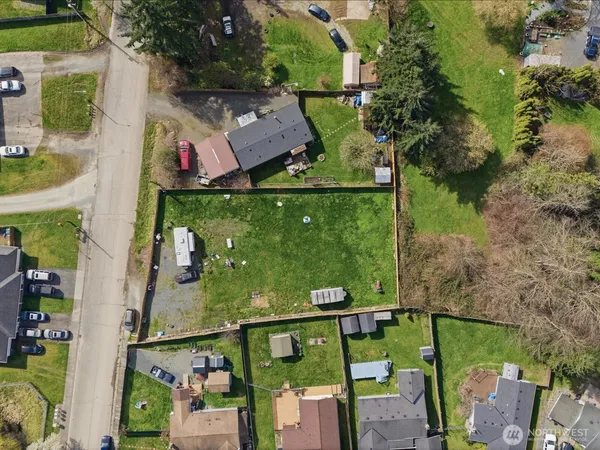 an aerial view of houses with yard