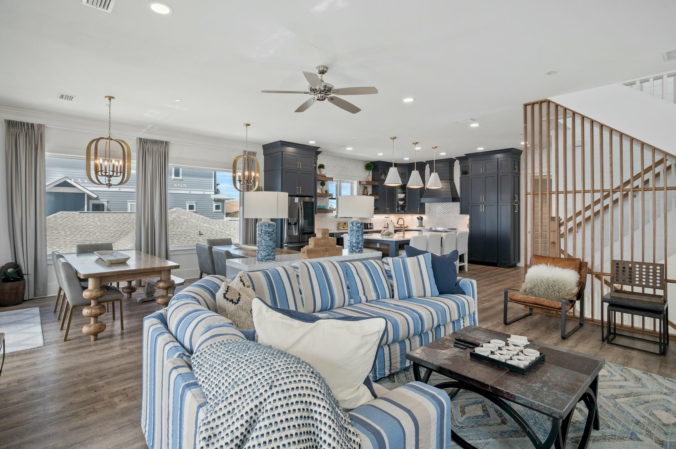 16515 Front Beach Road Panama City Beach, FL 32413 - Photo 17 of 46 a living room with furniture kitchen view and a chandelier