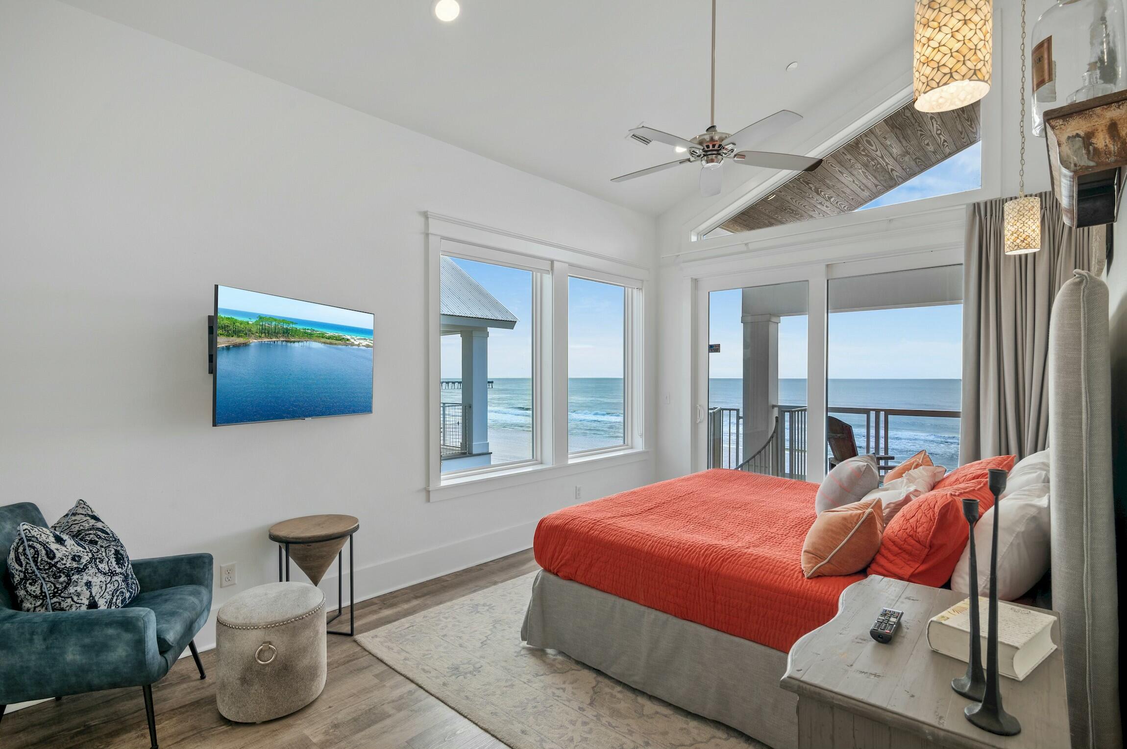 16515 Front Beach Road Panama City Beach, FL 32413 - Photo 33 of 46 a bedroom with a bed and glass window