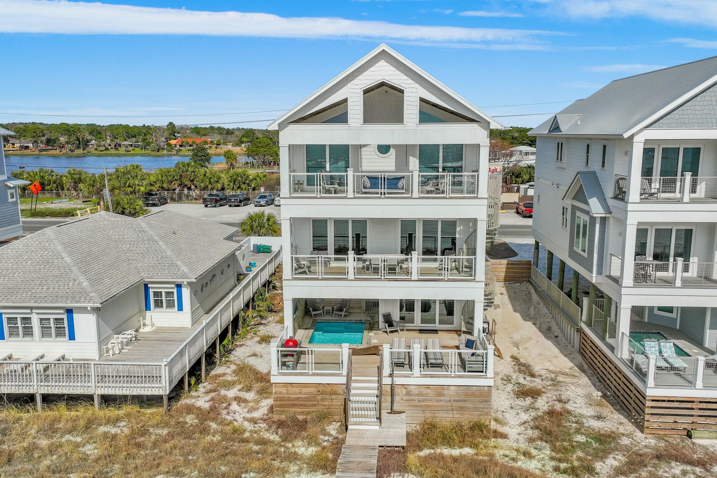 16515 Front Beach Road Panama City Beach, FL 32413 - Photo 5 of 46 a front view of a building with a lake view