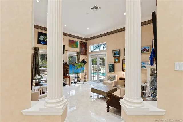 a bedroom with a bed and glass windows
