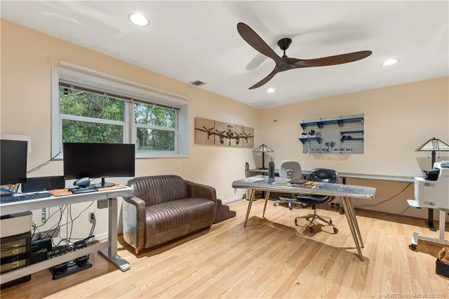 a dining hall with lots of tables and chairs