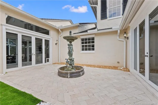 a dining room with lots of furniture and kitchen view