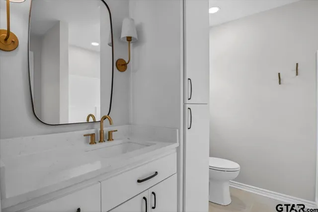 a bathroom with a toilet and a sink