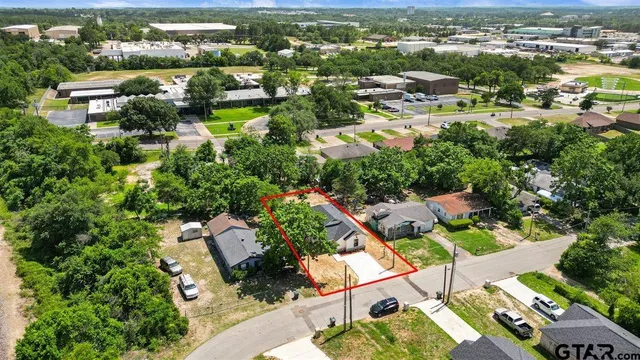 an aerial view of residential houses with outdoor space