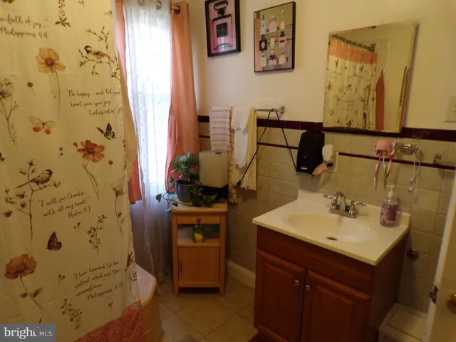 a bathroom with a sink and mirror