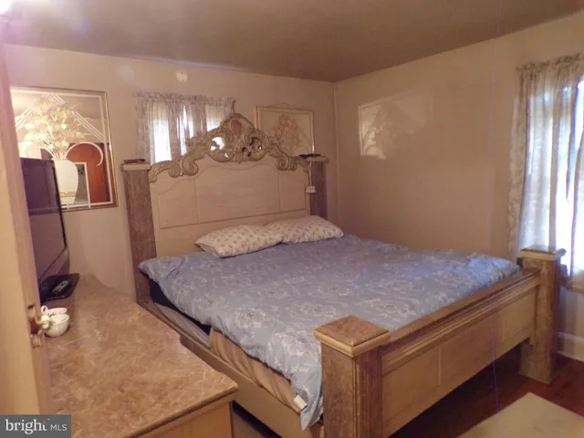 a bed room with a bed and a chandelier