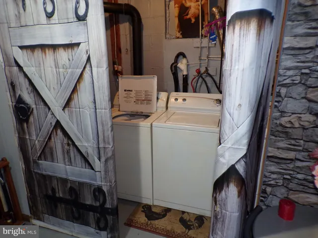 a view of storage and utility room with stairs