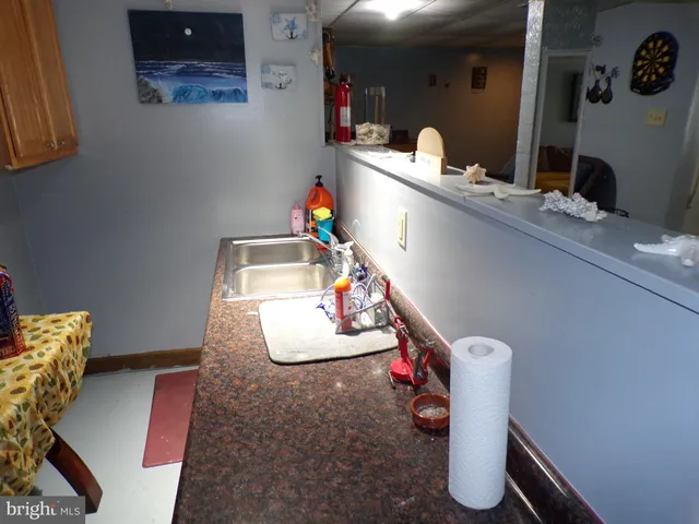 a bathroom with a sink mirror and vanity